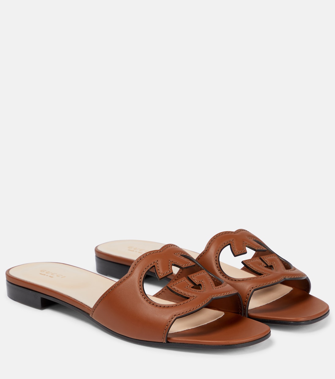 Interlocking G cutout leather sandals in brown - Gucci | Mytheresa