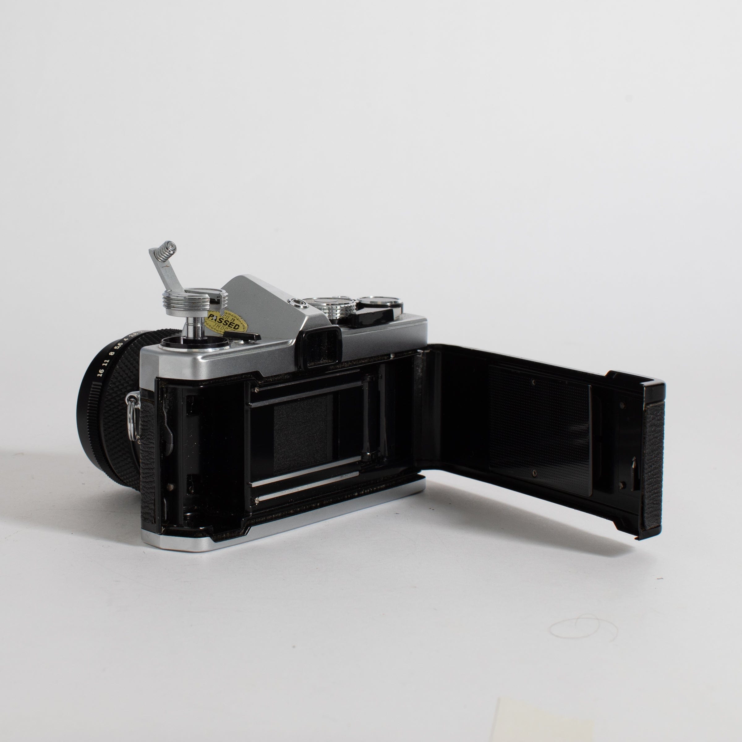 Olympus OM-1 with 50mm f/1.4 lens and leather case (film tested