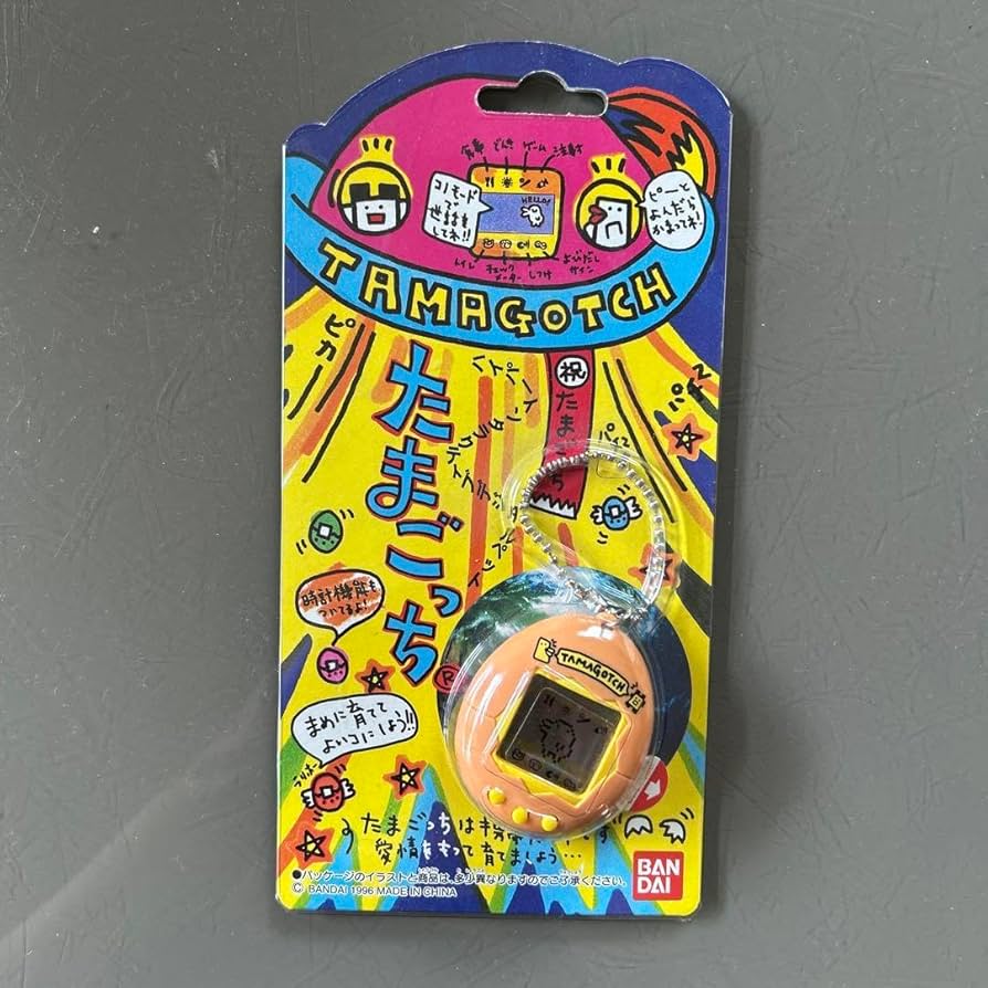 Amazon | 初代たまごっち オレンジ | ハンドヘルドゲーム | おもちゃ