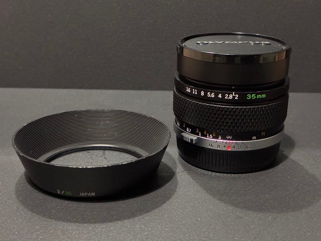オリンパス MC AUTO-W zuiko 35mm f/2 フード付き Olympus 35mm f2 Zuiko MC Auto-W Lens for OM | Blue Moon Camera