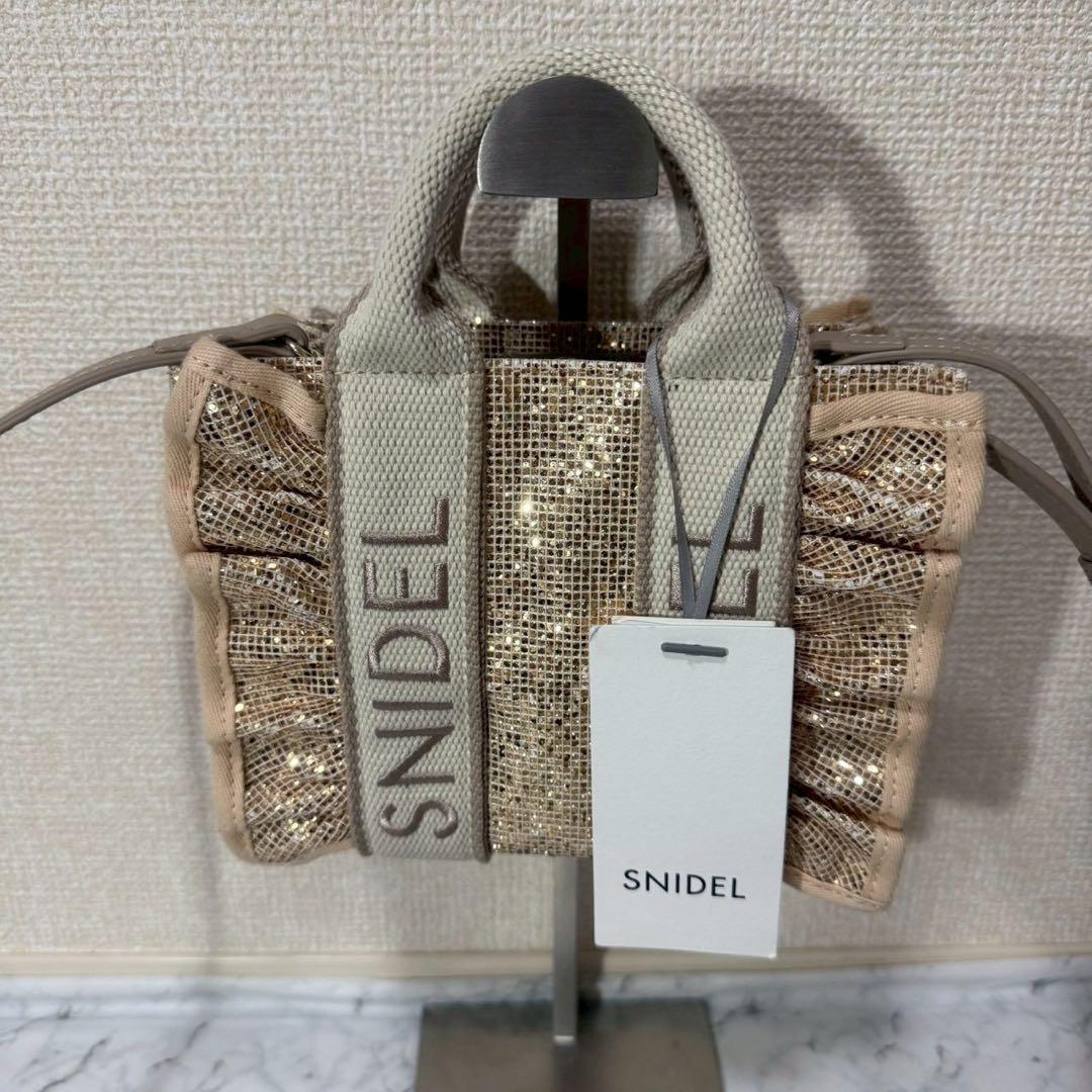 完売品】SNIDEL スナイデル フリルロゴミニバッグ タグ付き - メルカリ