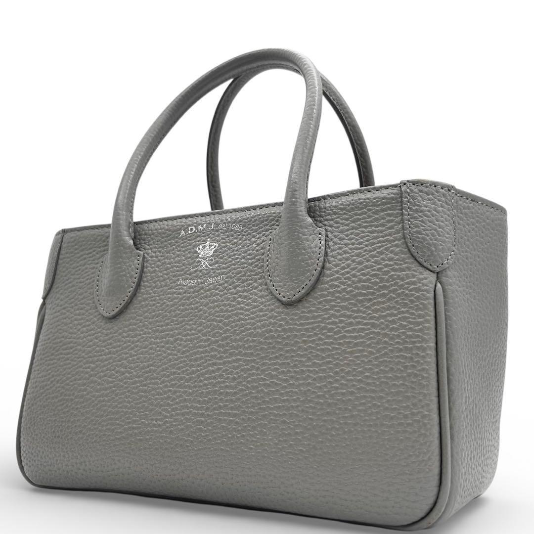 美品 A.D.M.J トートバッグ ハンドバッグ レザー グレー ロゴ 自立
